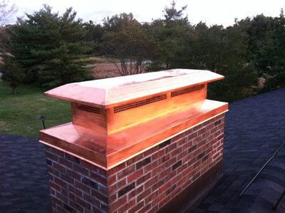 Before and after chimney cap replacement in Central Islip, NY