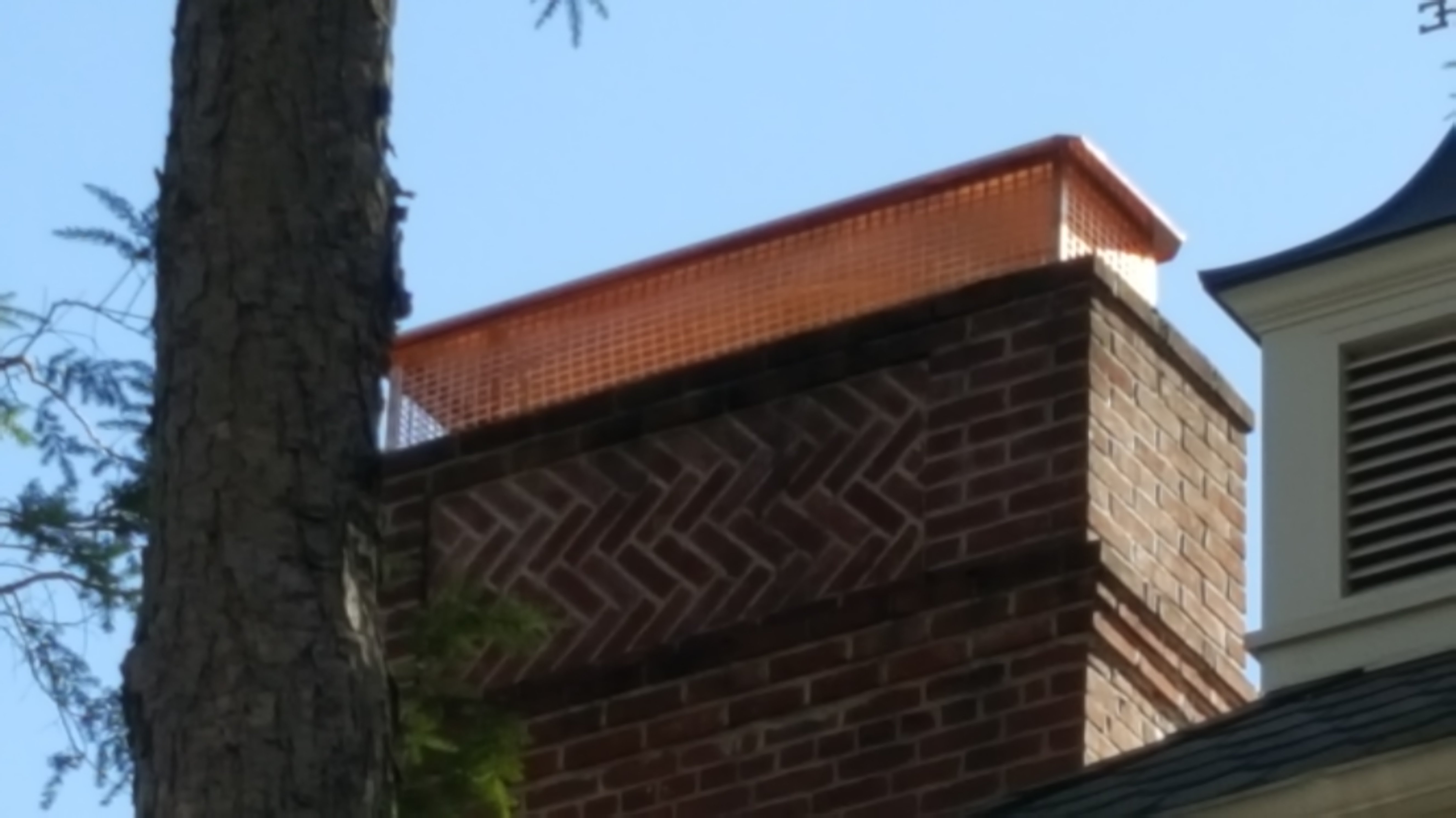 New stainless steel chimney cap installed in Central Islip, NY